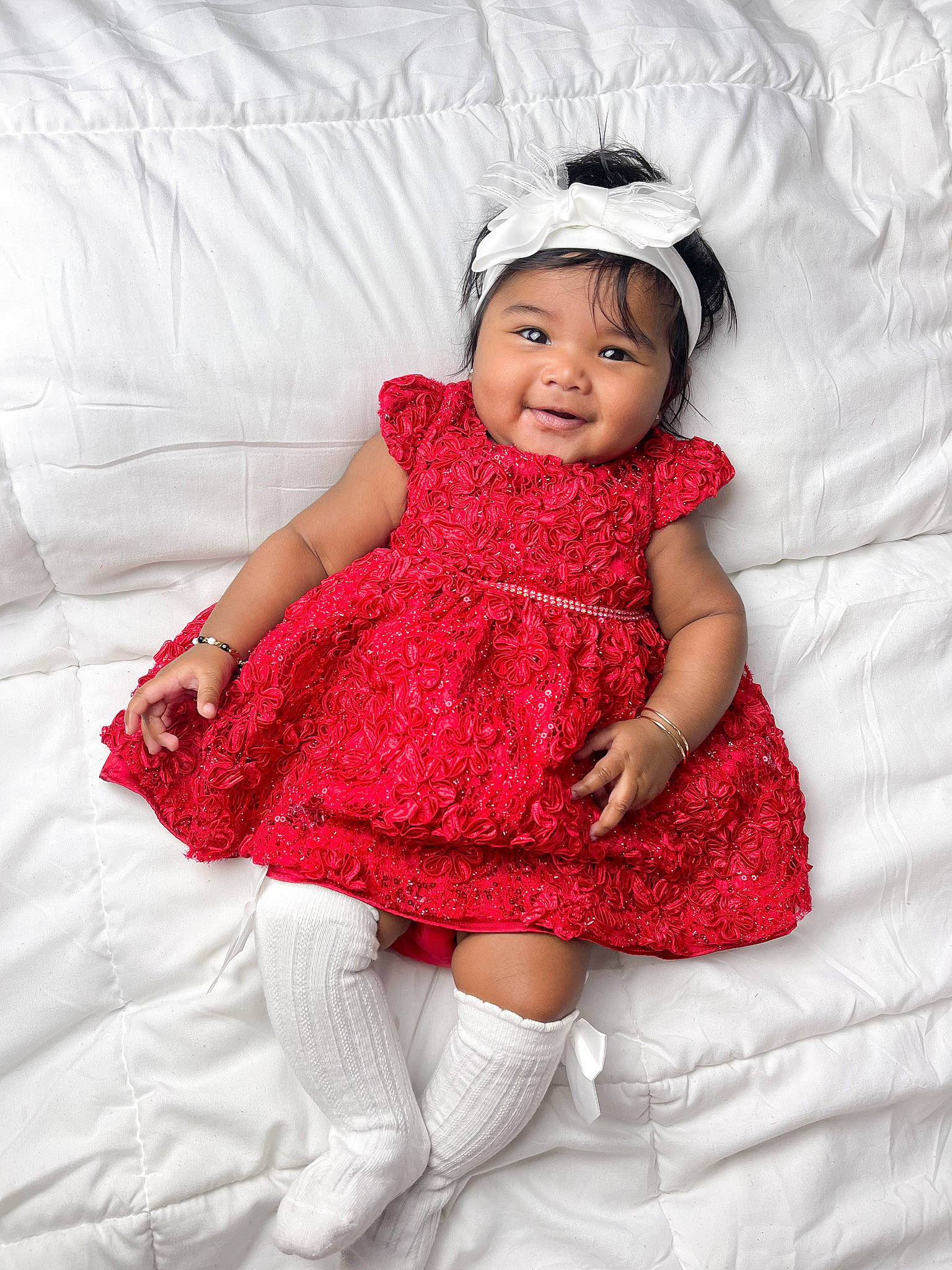 Kelsey is registered to the contest to win money with this photo: baby, baby_toddler_clothing, clothing, comfort, day_dress, dress, embellishment, eye, happy, head, headgear, headwear, joy, linens, lip, outerwear, person, pink, skin, sleeve