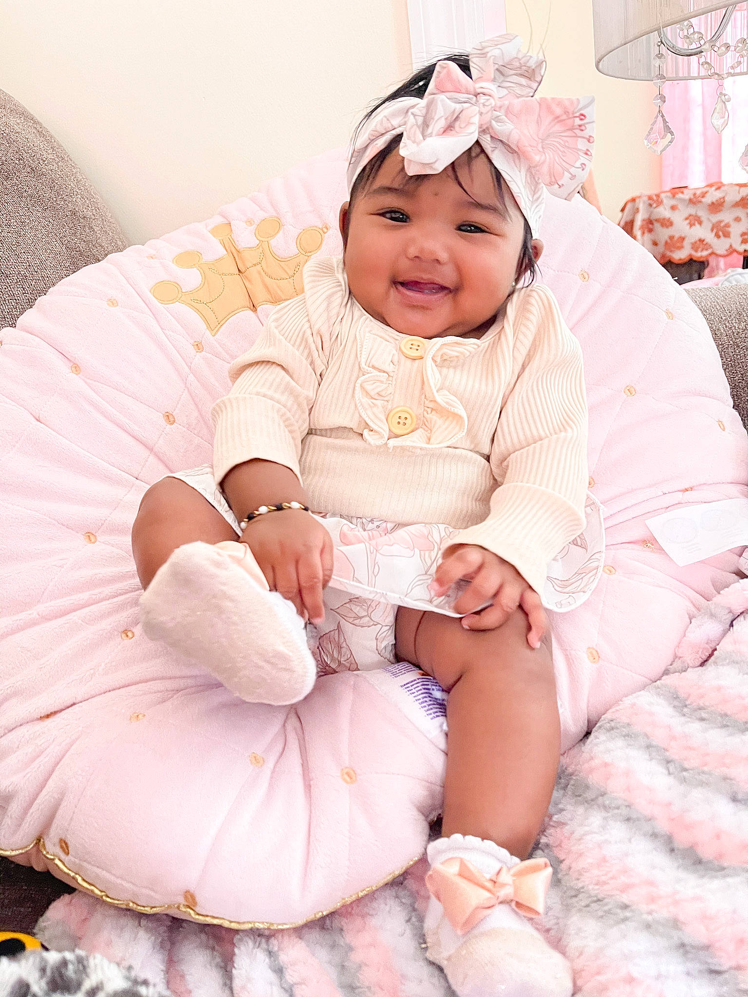 Kelsey joined the competition — help win amazing prizes! baby, baby_toddler_clothing, child, comfort, event, fun, happy, headwear, houseplant, joy, lap, linens, magenta, pattern, peach, person, pink, sitting, sleeve, smile