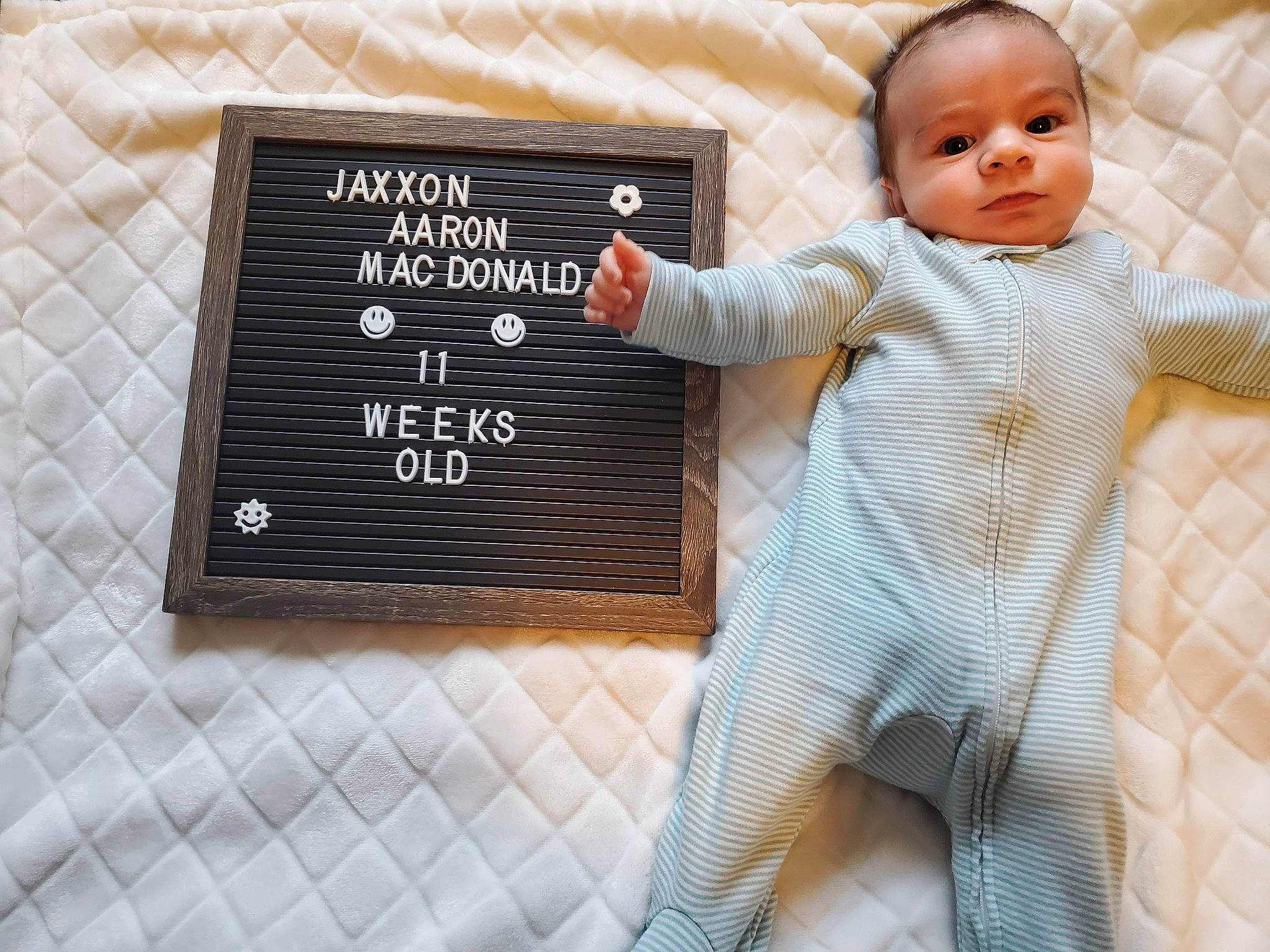 Jaxxon is registered to the contest to win money with this photo: baby, baby_safety, baby_sleeping, baby_toddler_clothing, blackboard, chalk, child, comfort, font, fur, happy, linens, pattern, person, room, sitting, slate, sleeve, t_shirt, toddler