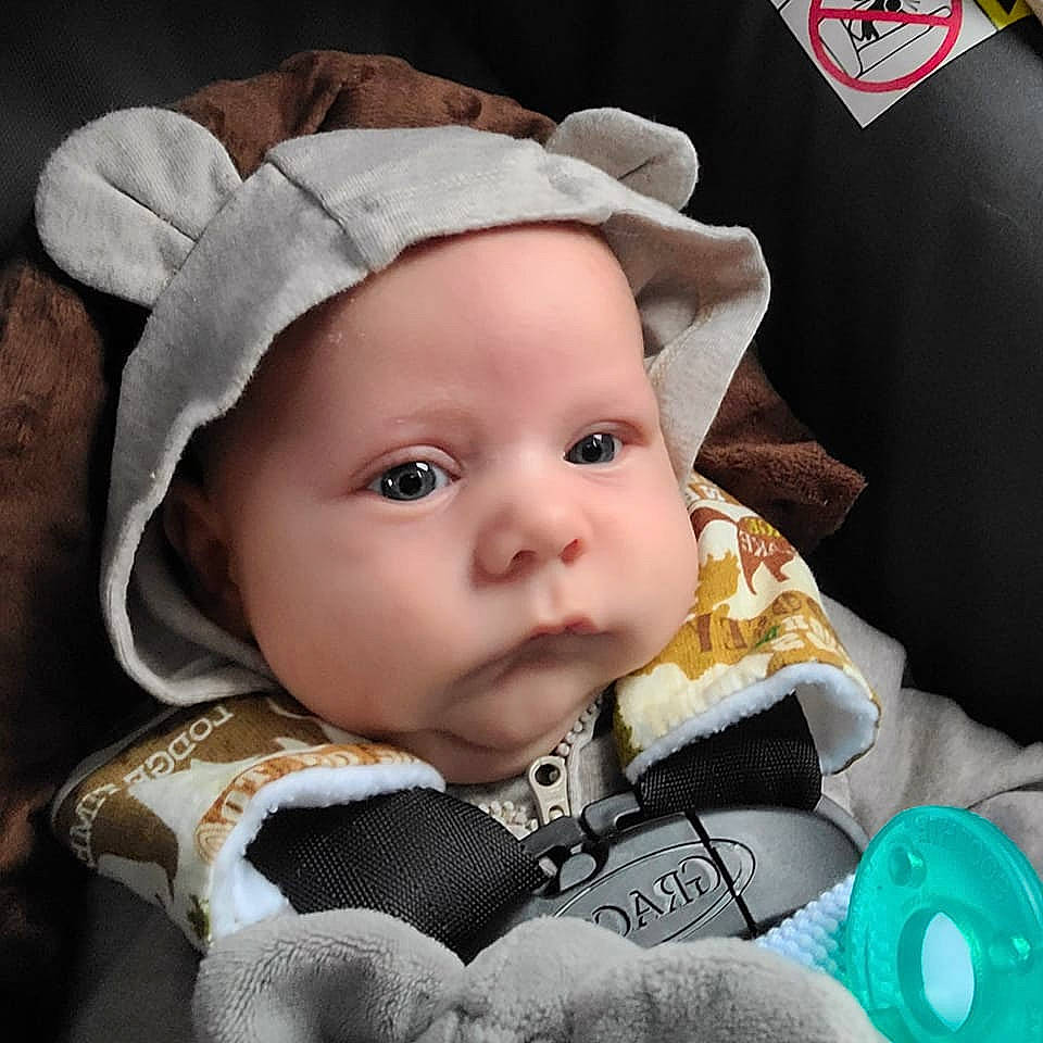 Maddux is registered to the contest to win money with this photo: baby, baby_products, baby_safety, baby_sleeping, baby_toddler_clothing, cap, cheek, child, comfort, costume_hat, eye, face, fashion_accessory, happy, hat, headwear, iris, linens, pattern, person