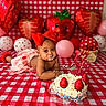 baby, child, cake, strawberry, balloon, red_bow, checkered_tablecloth, birthday, celebration, cream, sprinkles, decorations, cute, messy, smiling, face, hands, pink_balloon, heart_balloon, photography