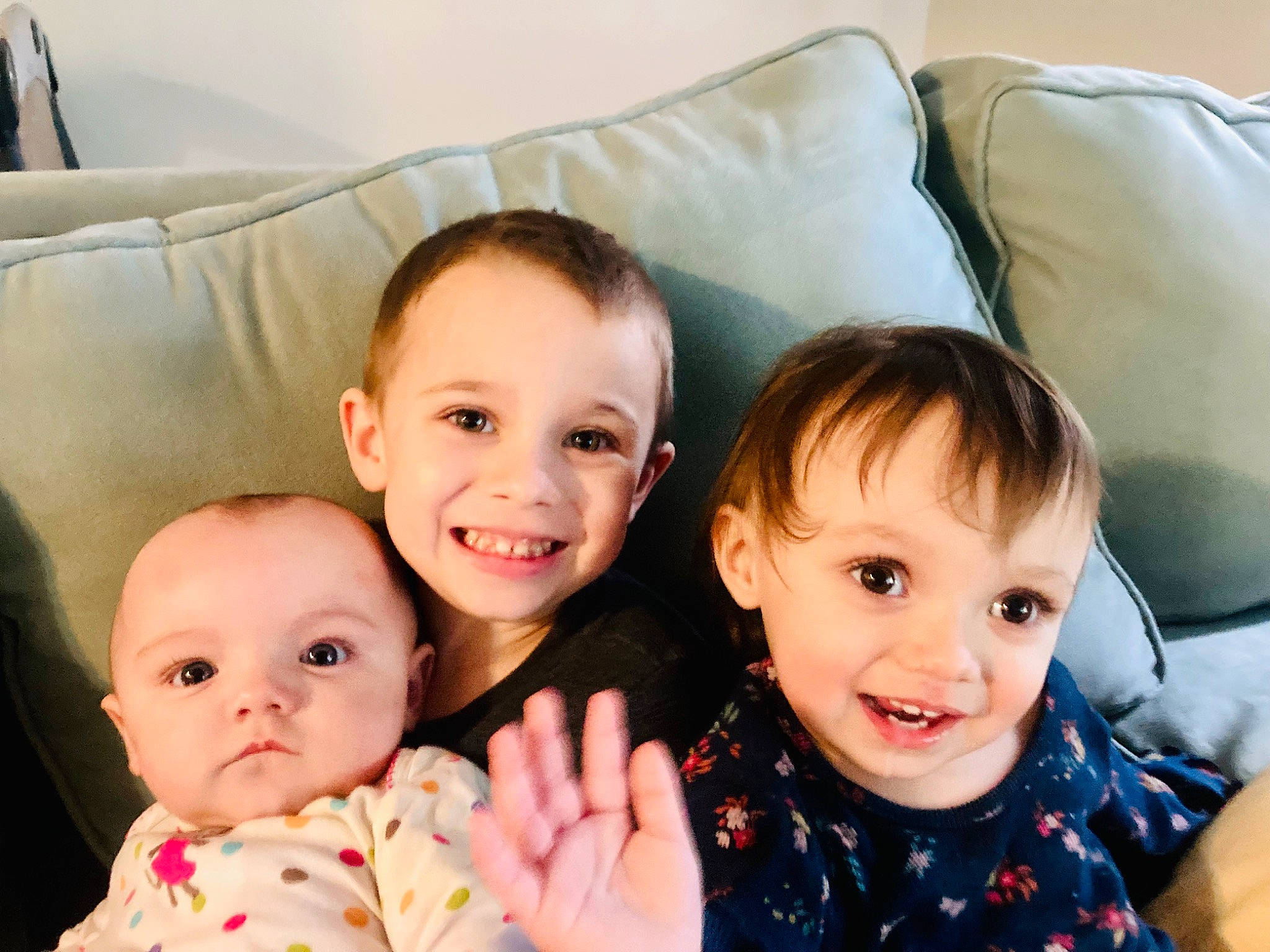 Hunter is registered to the contest to win money with this photo: baby, baby_toddler_clothing, cheek, child, comfort, couch, event, eye, face, finger, fun, gesture, happy, head, iris, joy, person, product, skin, smile