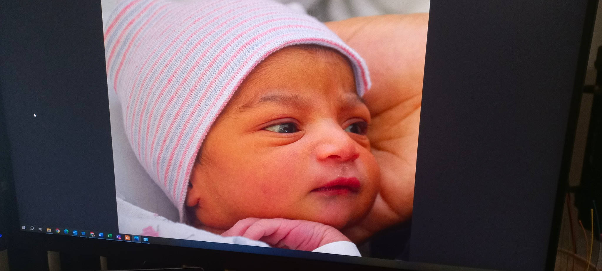 Krisha is registered to the contest to win money with this photo: baby, cap, cheek, chin, comfort, eye, eyebrow, eyelash, face, happy, headgear, headwear, lip, mouth, nose, output_device, person, pink, product, skin