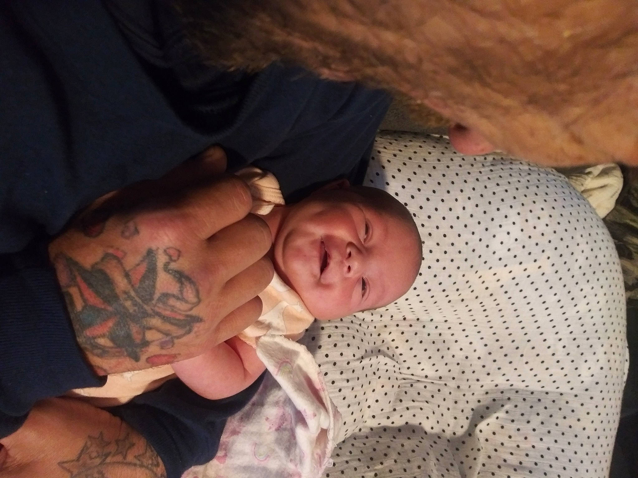 Elyse is registered to the contest to win money with this photo: arm, baby, birth, child, flesh, hand, human, muscle, person, sleep, tattoo, toddler