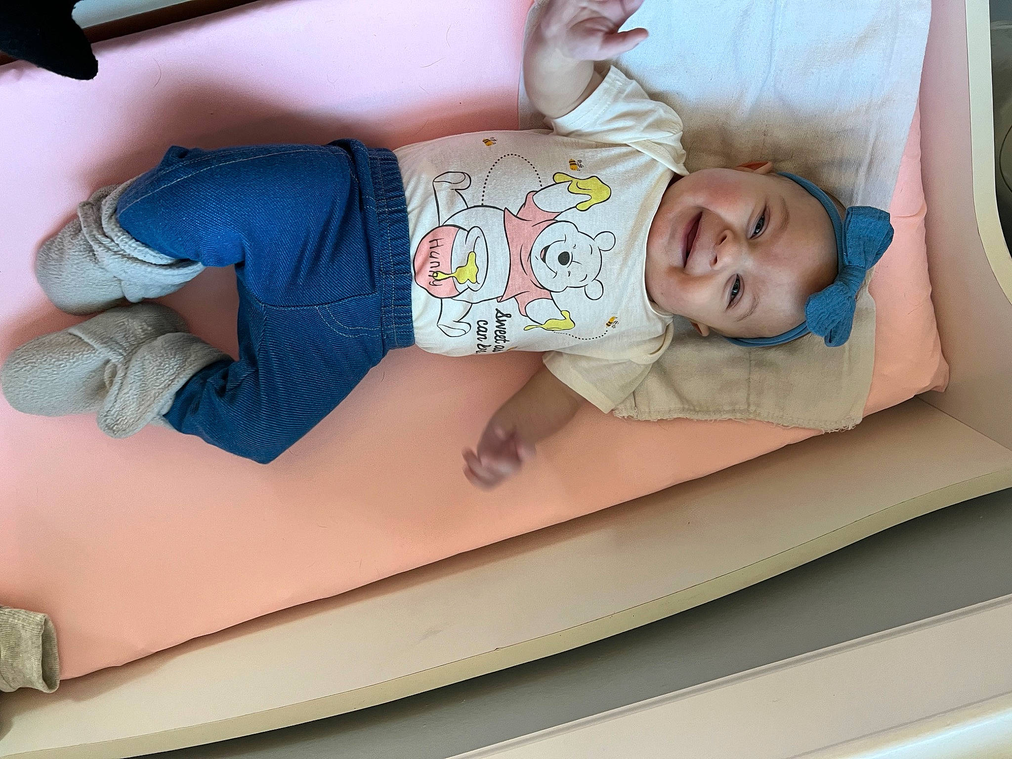 Veronica is registered to the contest to win money with this photo: automotive_exterior, baby, baby_products, baby_toddler_clothing, child, comfort, fun, headwear, human_leg, joy, leisure, linens, pattern, person, room, sleeve, smile, t_shirt, thigh, toddler