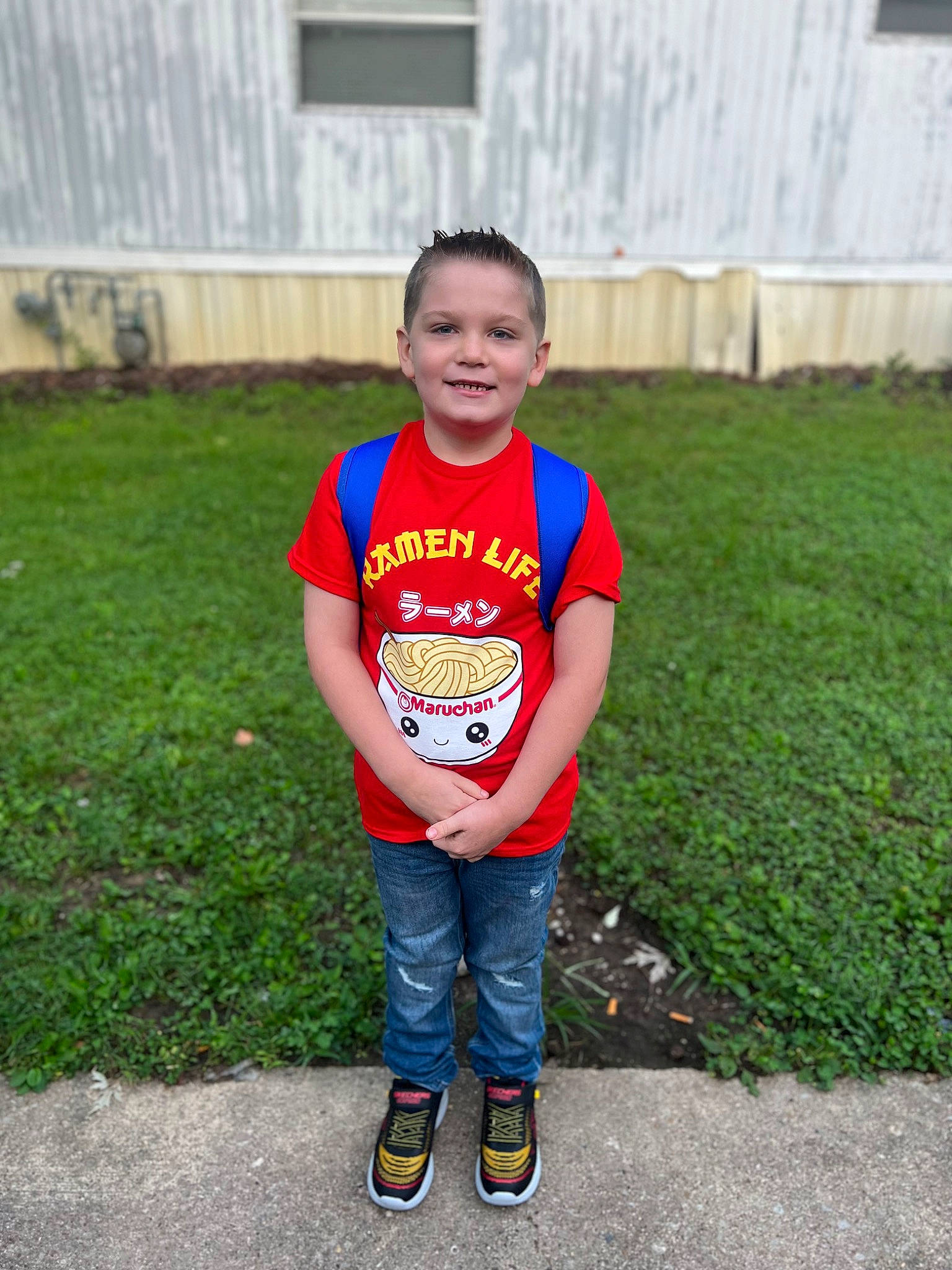 Camden is registered to the contest to win money with this photo: baby_toddler_clothing, chin, eye, face, footwear, grass, happy, head, jeans, joy, lawn, leg, leisure, person, plant, recreation, shoe, sleeve, smile, t_shirt