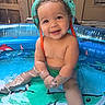 baby, child, infant, smiling, happy, pool, swimming_pool, water, outdoor, sun_hat, wet, portrait, sitting, summer, backyard, inflatable_pool, colorful, face, arms, legs