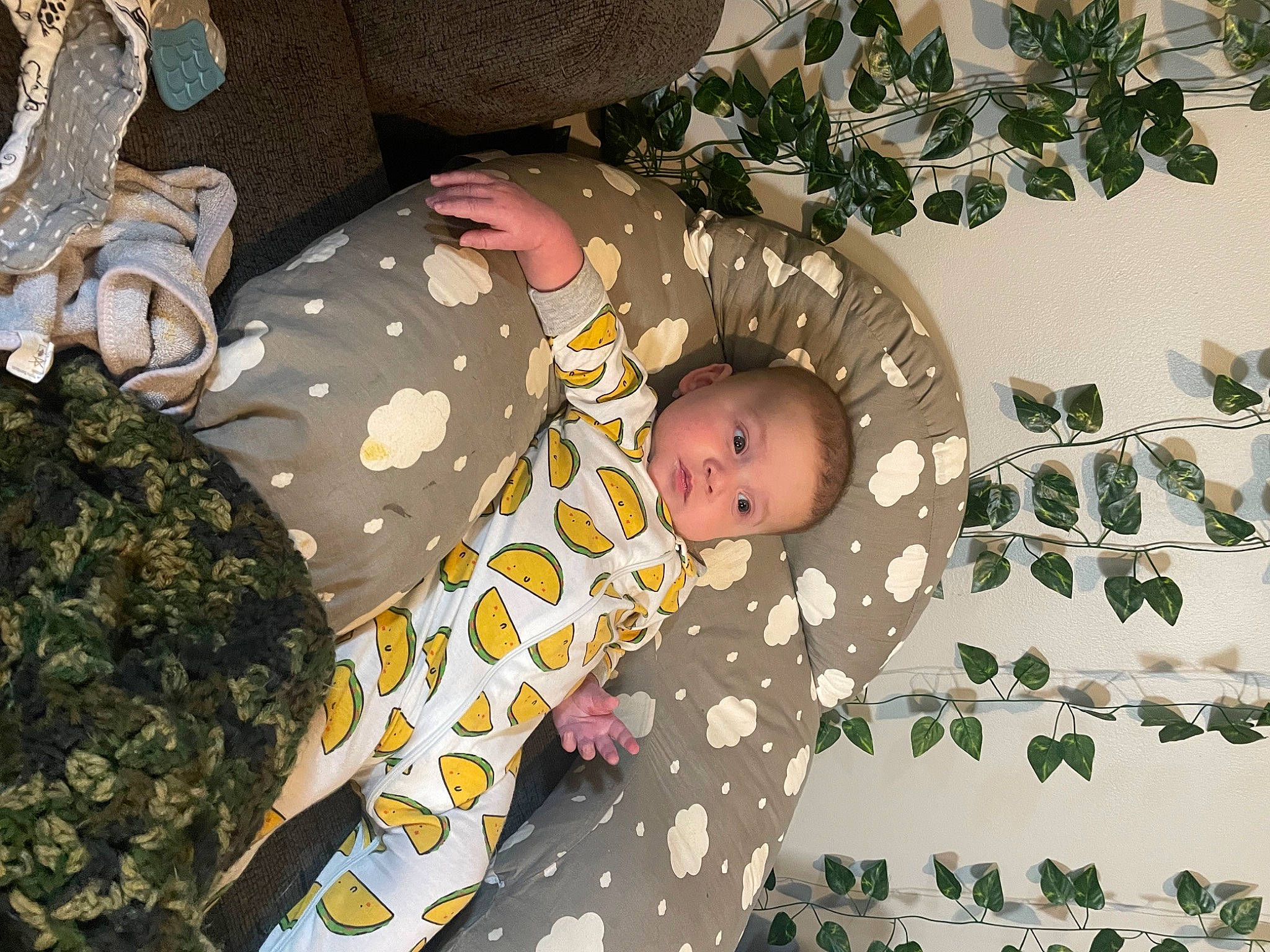Luciano is registered to the contest to win money with this photo: baby, baby_products, baby_toddler_clothing, camouflage, child, christmas_tree, comfort, fir, linens, military_camouflage, ornament, pattern, person, plant, room, textile, toddler, tree, twig