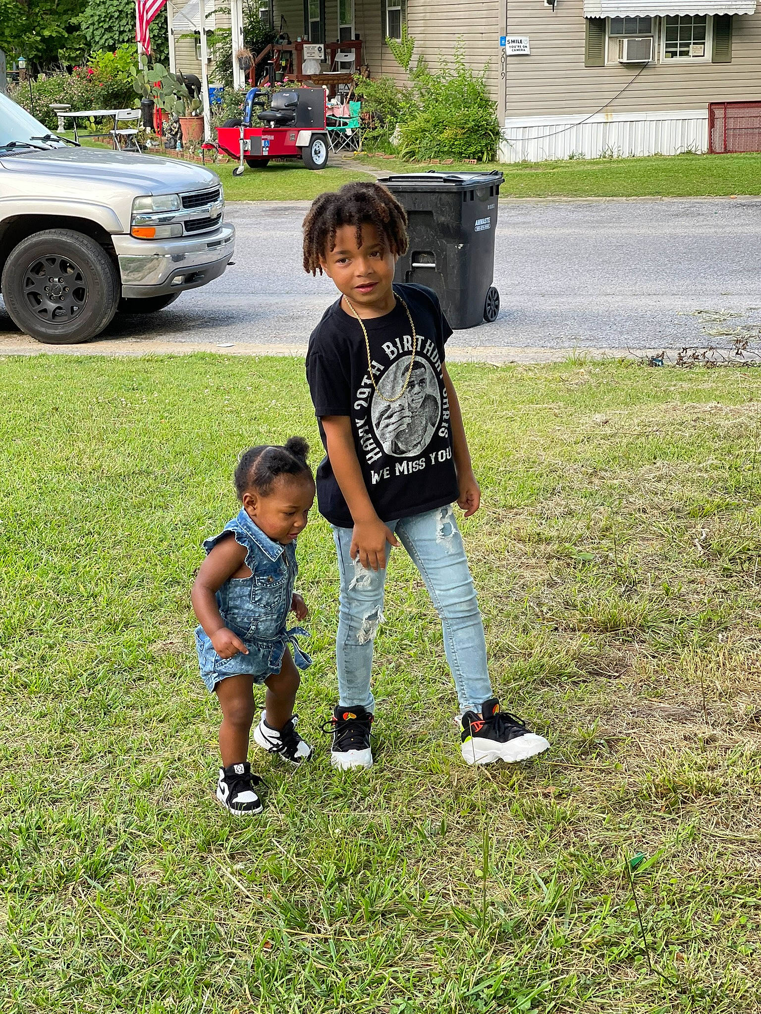 Kaison joined the competition — help win amazing prizes! automotive_lighting, automotive_tire, car, footwear, fun, grass, lawn, leisure, people_in_nature, person, plant, recreation, shoe, shorts, sneakers, tire, toddler, tree, vehicle, vehicle_door