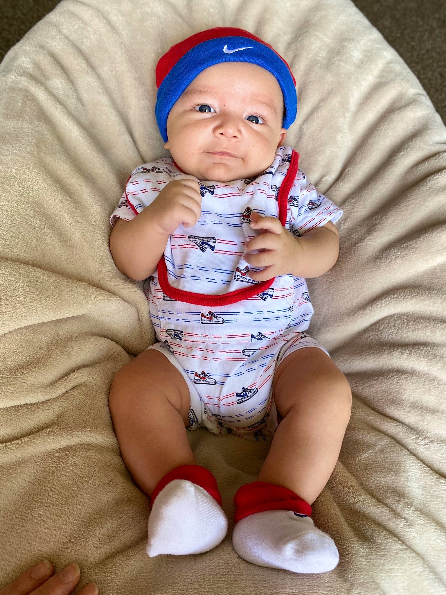 Derek joined the competition — help win amazing prizes! baby, baby_toddler_clothing, cap, cheek, child, comfort, eye, face, facial_expression, hand, head, headwear, human_body, knee, mouth, person, skin, sleeve, smile, sock
