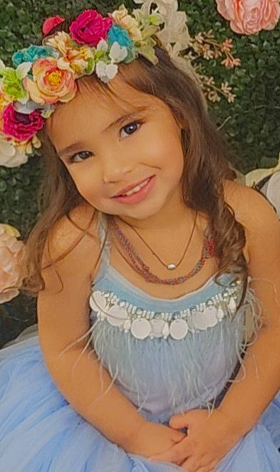 Sia joined the competition — help win amazing prizes! beauty, child, dress, eye, facial_expression, flower, hair, hairstyle, happy, head, headgear, headpiece, headwear, iris, joy, person, petal, pink, plant, skin