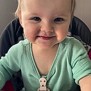 Scarlett joined the competition — help win amazing prizes! baby, child, toddler, smiling, portrait, high_chair, floral_headband, bow, mint_green_clothing, indoors, seated, face, blue_eyes, blonde_hair, happy, infant, feeding_tray, home, close_up, photography