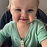 baby, child, toddler, smiling, portrait, high_chair, floral_headband, bow, mint_green_clothing, indoors, seated, face, blue_eyes, blonde_hair, happy, infant, feeding_tray, home, close_up, photography