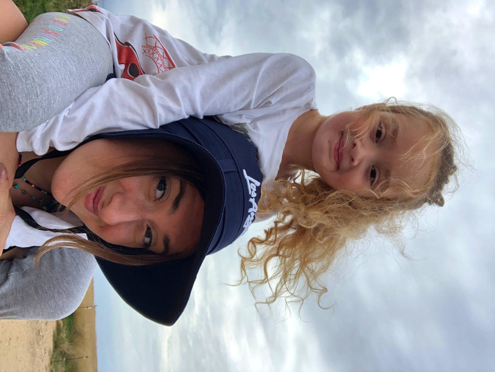 Loona participe au concours pour gagner de l'argent avec cette photo : child, cloud, eye, facial_expression, flash_photography, fun, grass, hair, happy, head, headwear, interaction, joy, leisure, organ, people, people_in_nature, person, skin, sky