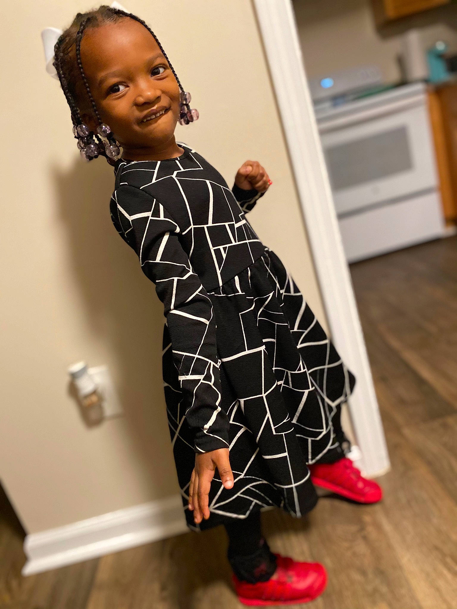 Amoni is registered to the contest to win money with this photo: arm, dress, face, fashion_design, finger, flooring, gesture, hairstyle, hand, happy, joint, joy, knee, one_piece_garment, person, shoulder, sleeve, smile, street_fashion, thumb