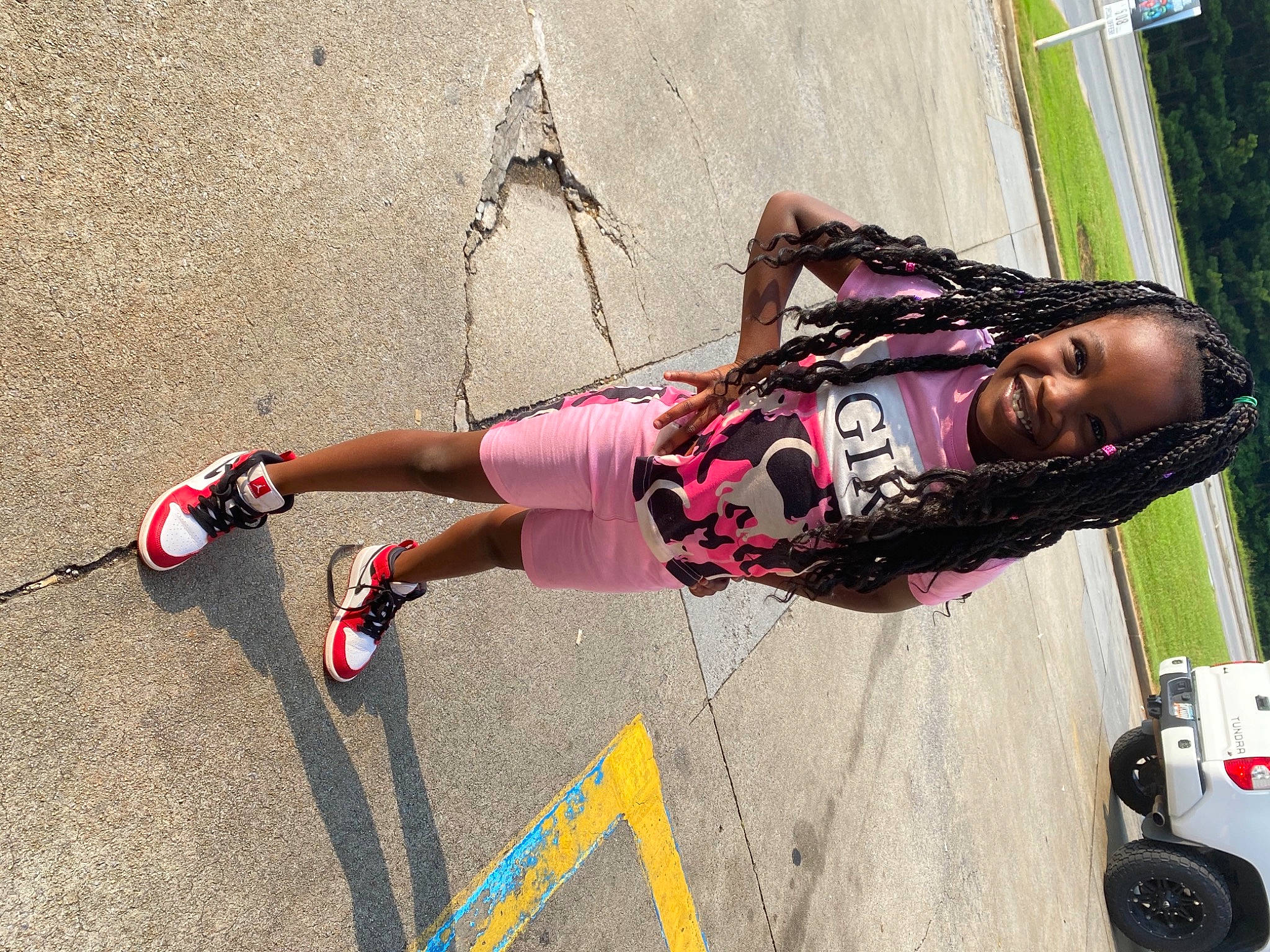 Alyza is registered to the contest to win money with this photo: asphalt, boot, eyewear, helmet, human_leg, joy, knee, leg, leisure, magenta, person, plant, recreation, rock_climbing_equipment, shorts, sneakers, sports_equipment, street_fashion, thigh, tire