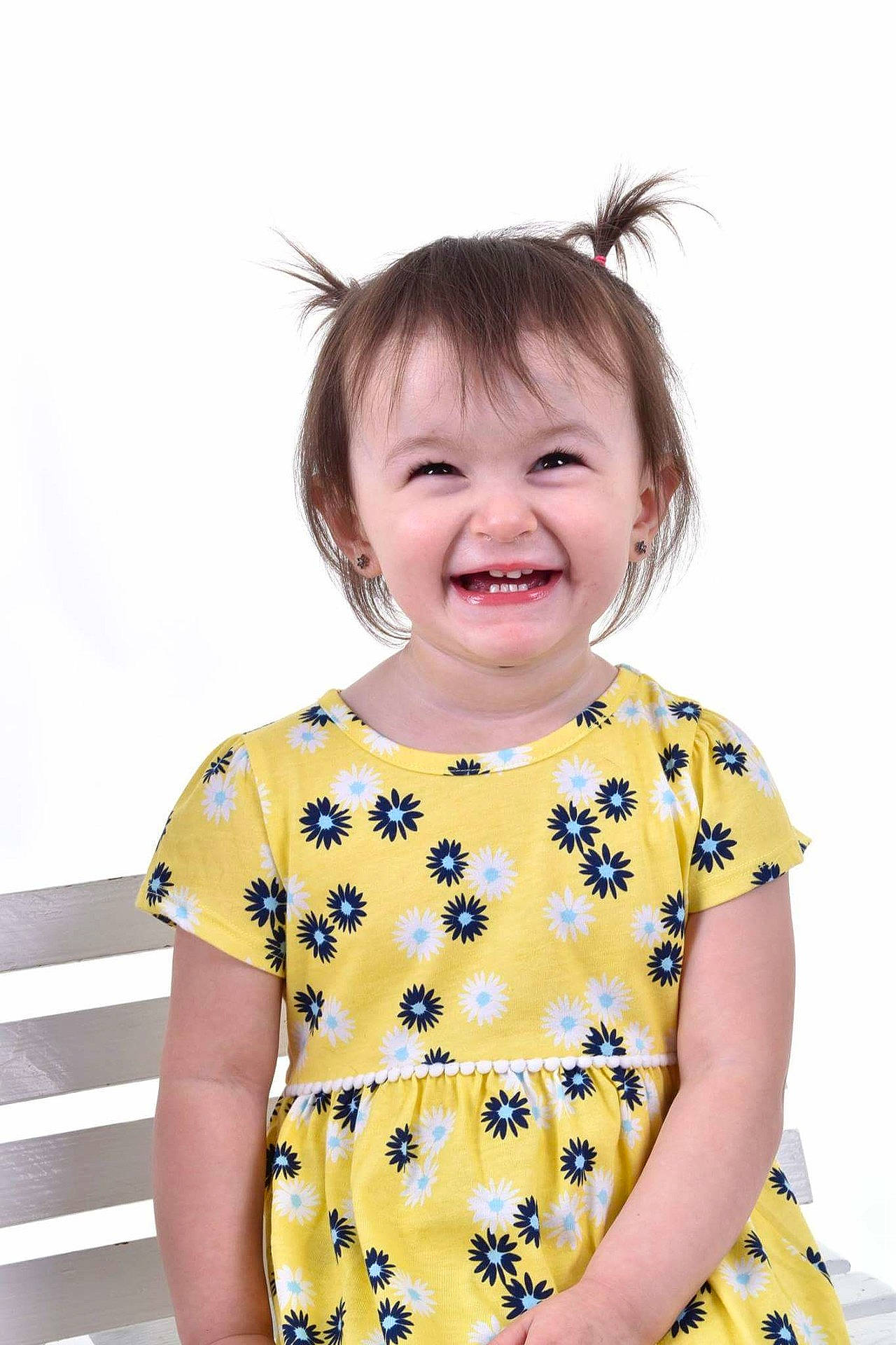 Paisley Grace is registered to the contest to win money with this photo: child, child_model, design, facial_expression, girl, hair, happiness, joy, neck, nose, pattern, person, shoulder, sleeve, smile, t_shirt, toddler, top, yellow