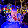 Thessa participe au concours pour gagner de l'argent avec cette photo : baby, child, princess_dress, face_paint, disney, night, lights, crowd, street_lamp, smile, person, costume, celebration, party, event, indoor, hand, blue_lighting, happy, portrait