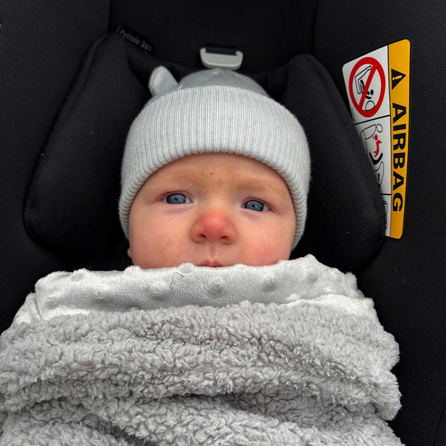 Isla joined the competition — help win amazing prizes! baby, beanie, blanket, bonnet, cap, car, car_interior, carseat, clothing, cushion, face, hat, head, hood, newborn, person, photography, portrait, transportation, vehicle