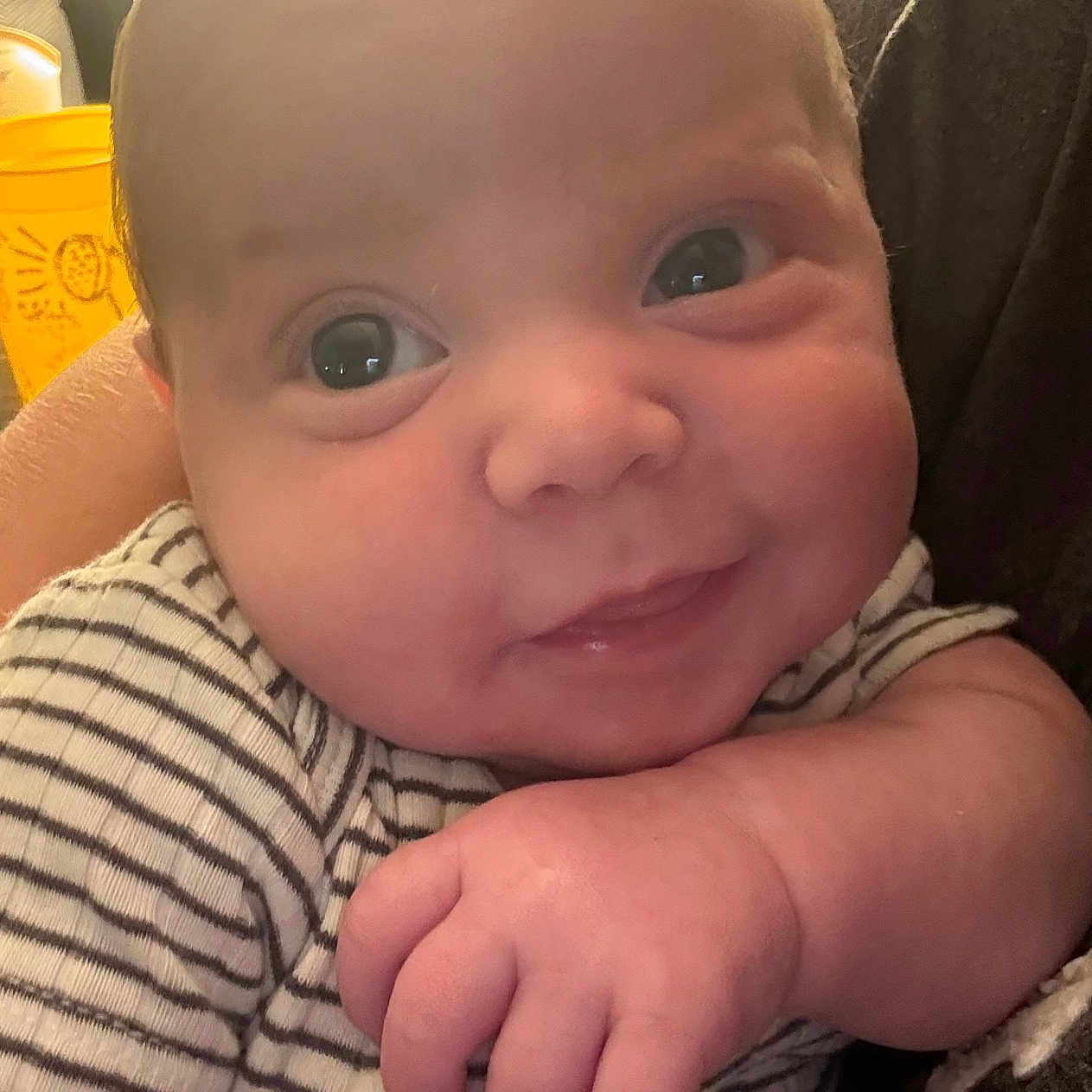 Tye is registered to the contest to win money with this photo: baby, babylaughing, bodypart, clothing, face, happy, head, laughing, mouth, newborn, person, photography, portrait, selfie, smile, t_shirt, teeth