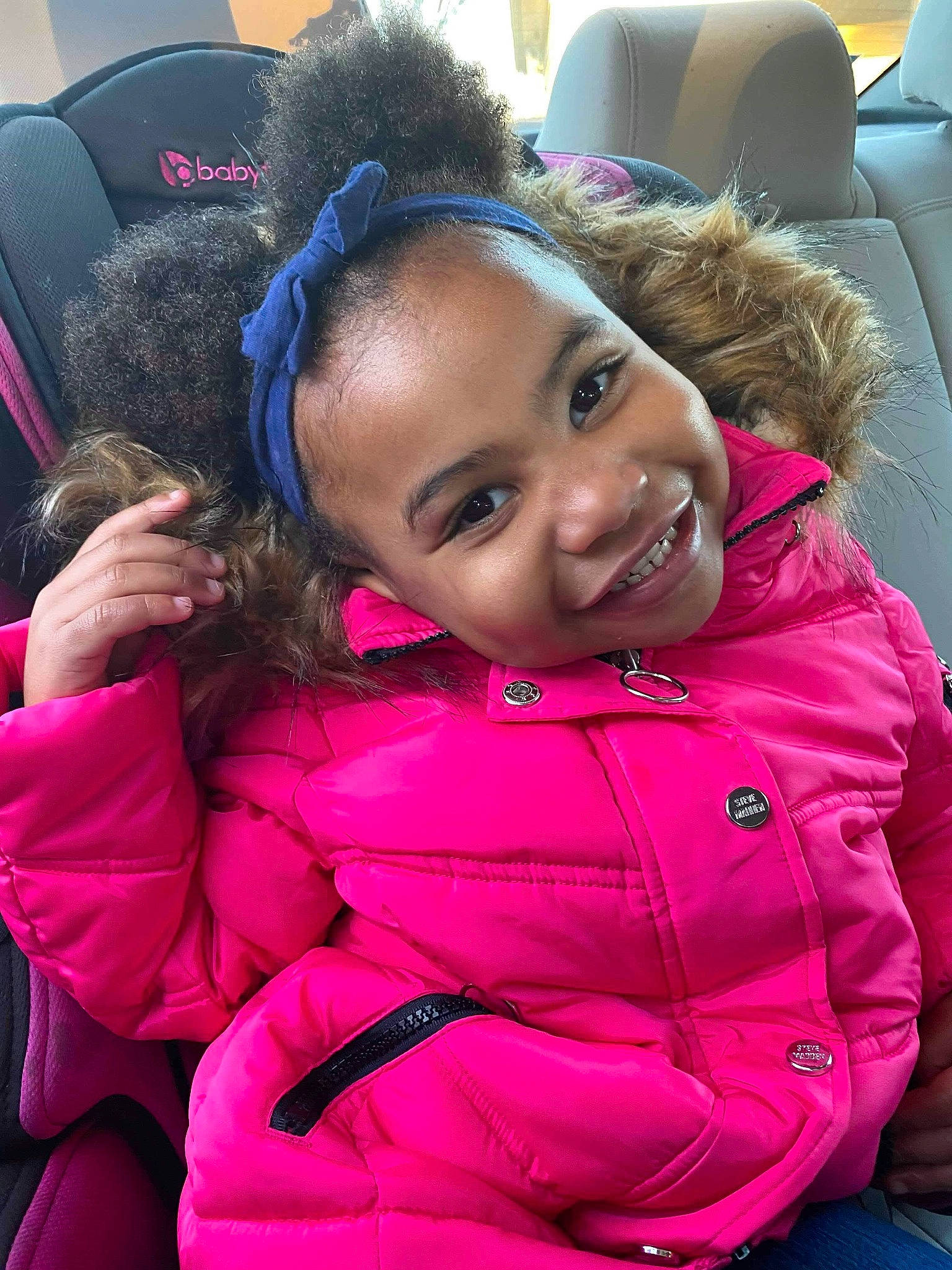 Dezire joined the competition — help win amazing prizes! black_hair, car_seat, cheek, child, ear, face, fun, fur, head, jacket, joy, magenta, outerwear, person, pink, skin, smile, toddler