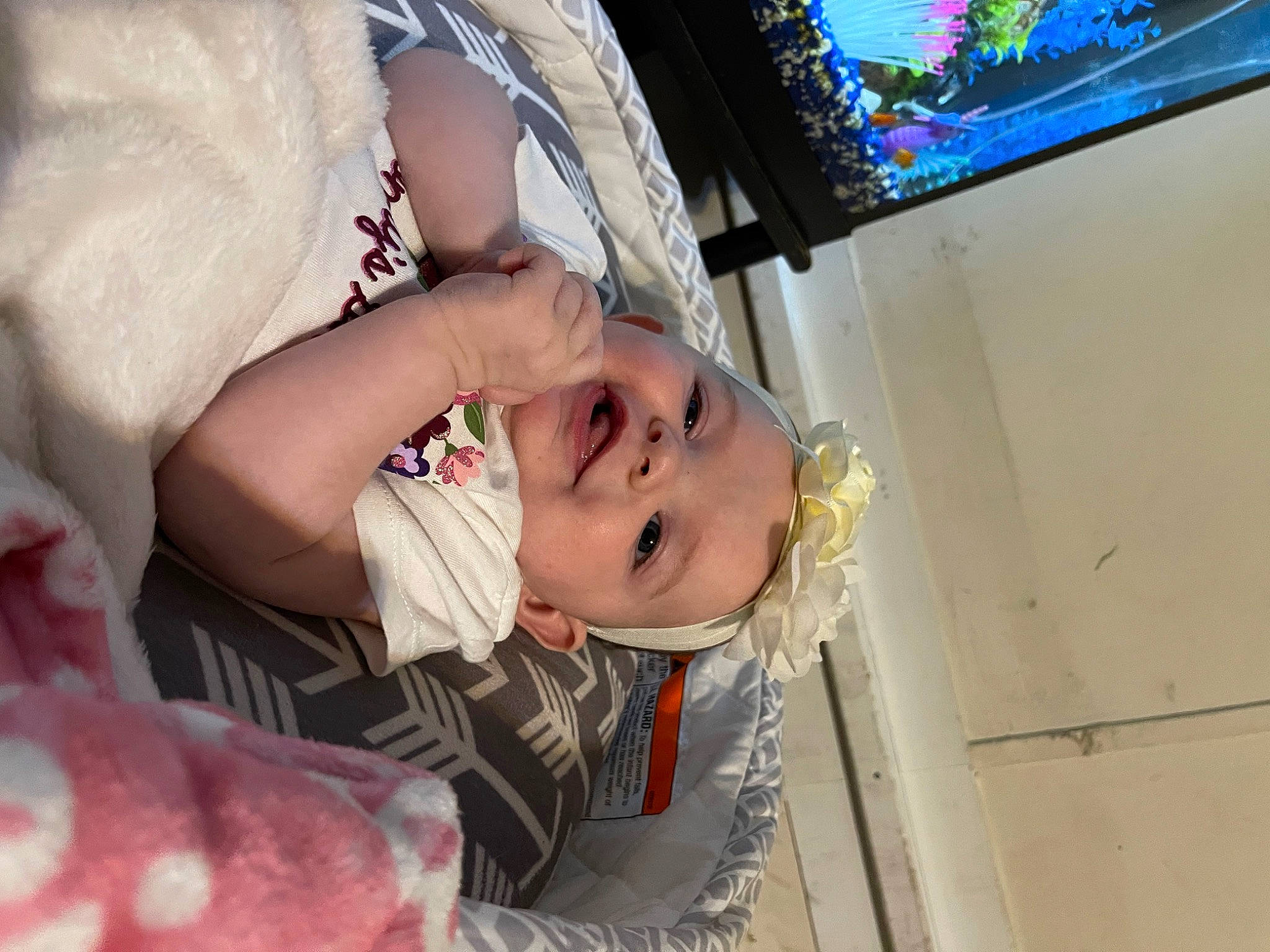 Hazleigh is registered to the contest to win money with this photo: audio_equipment, baby, baby_products, baby_toddler_clothing, child, display_device, dress, eye, eyelash, flat_panel_display, fun, happy, person, room, skin, smile, television, television_set, toddler, tree