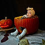 Carla a rejoint le concours — aidez-le/la à gagner de superbes lots ! baby, pumpkin, headband, socks, blanket, autumn_leaves, jack_o_lantern, carved_pumpkin, halloween, cute, infant, orange, fall, cozy, child, costume, holiday, decor, indoors, curious