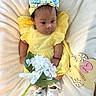 Kalaiah is registered to the contest to win money with this photo: baby, blanket, child, cute, decor, flower, footwear, headband, indoors, infant, milestone, person, portrait, sitting, smiling, soft_texture, white_flower, white_shoes, wooden_sign, yellow_dress