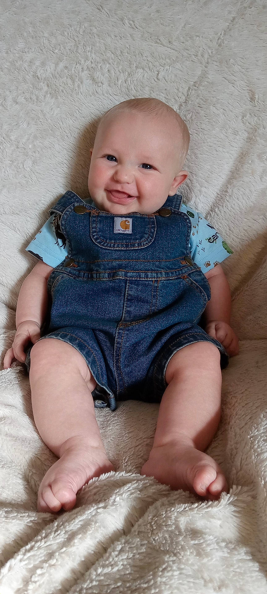 Cooper joined the competition — help win amazing prizes! baby, bodypart, clothing, couch, face, finger, furniture, hand, happy, head, jeans, newborn, pants, person, photography, portrait, shorts, sitting, smile, vest