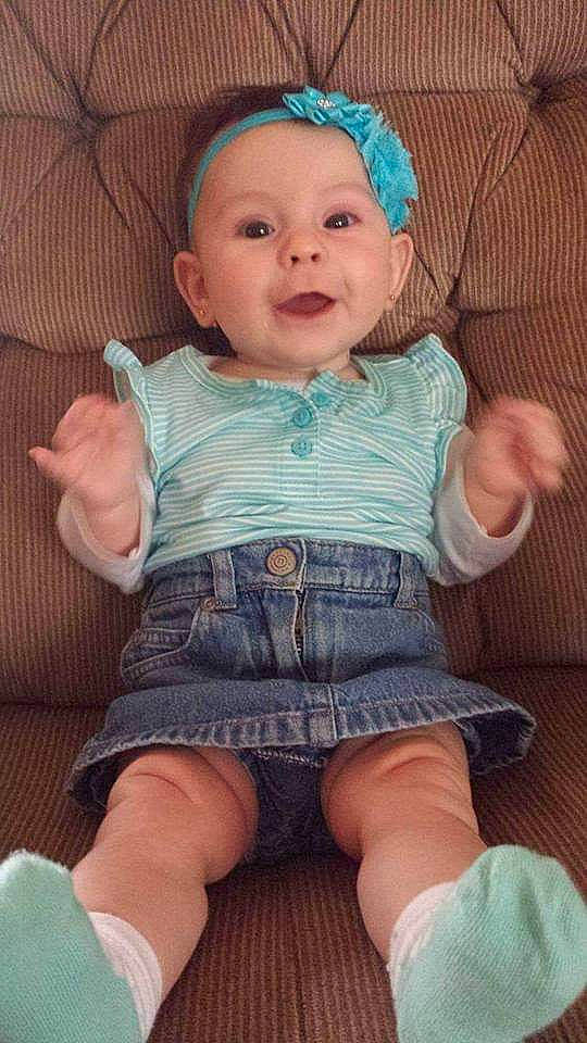 Sadie joined the competition — help win amazing prizes! baby_toddler_clothing, blue, cheek, dress, eye, finger, glasses, hairstyle, hand, head, iris, leg, lip, mouth, nose, person, pink, skin, sleeve, smile