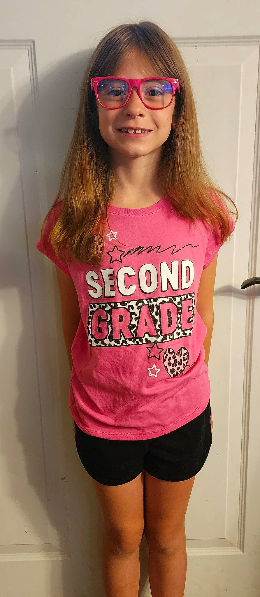 Sadie is registered to the contest to win money with this photo: arm, clothing, cool, eyelash, eyewear, joint, joy, lip, muscle, neck, organ, person, pink, shoulder, sleeve, smile, standing, t_shirt, thigh, vision_care