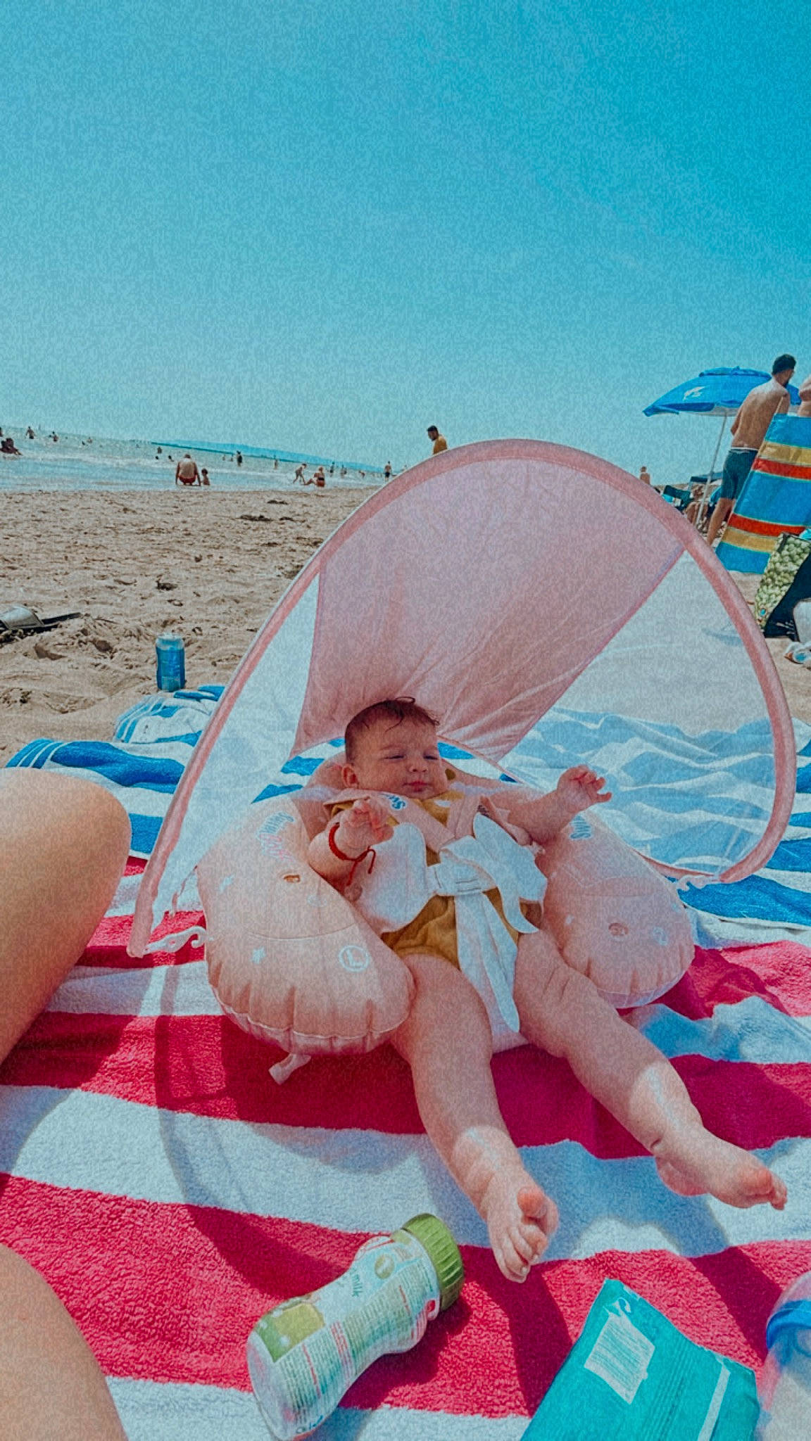 Eva-maria joined the competition — help win amazing prizes! aqua, azure, baby, beach, blue, fun, happy, leisure, outdoor_furniture, people_in_nature, people_on_beach, person, photograph, recreation, shade, shorts, sky, sunlounger, toddler, travel