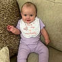 Taliah joined the competition — help win amazing prizes! baby, child, smiling, sitting, pajamas, bib, couch, cushion, indoor, happy, infant, person, face, clothing, home, cute, comfortable, relaxed, portrait, young
