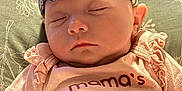 Joni joined the competition — help win amazing prizes! baby, blanket, child, closeup, clothing, cute, fabric, face, green, headband, infant, pattern, peaceful, pillow, pink, portrait, rest, sleeping, soft, text