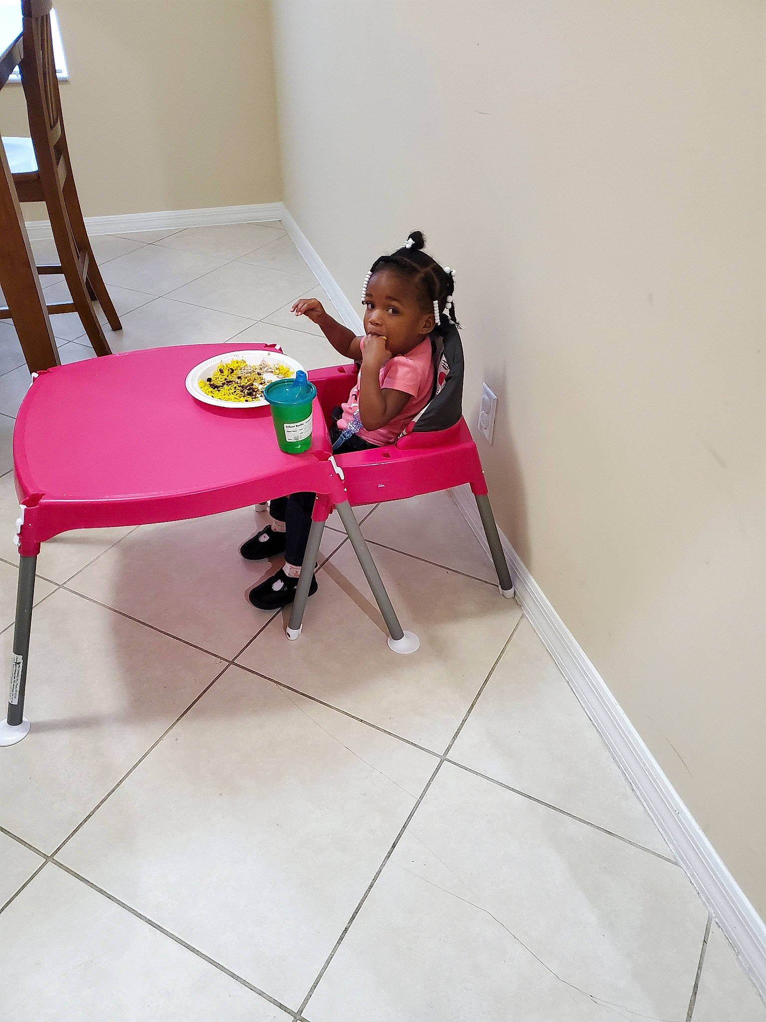 Jaydynn West is registered to the contest to win money with this photo: chair, child, design, floor, flooring, fun, furniture, house, interior_design, person, pink, play, red, room, sitting, table, tile, toddler, vacation