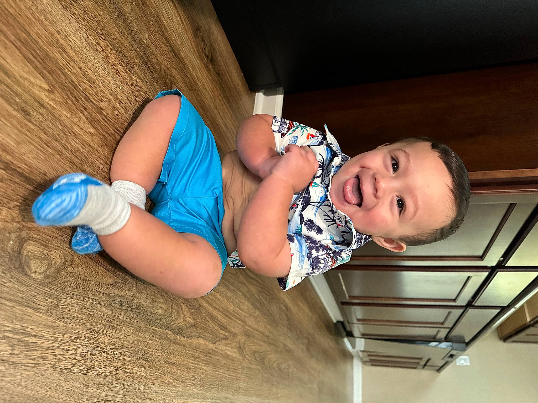Evan is registered to the contest to win money with this photo: abdomen, baby, baby_toddler_clothing, child, comfort, elbow, electric_blue, flash_photography, fun, human_leg, joy, knee, leg, person, room, sitting, skin, smile, sock, thigh