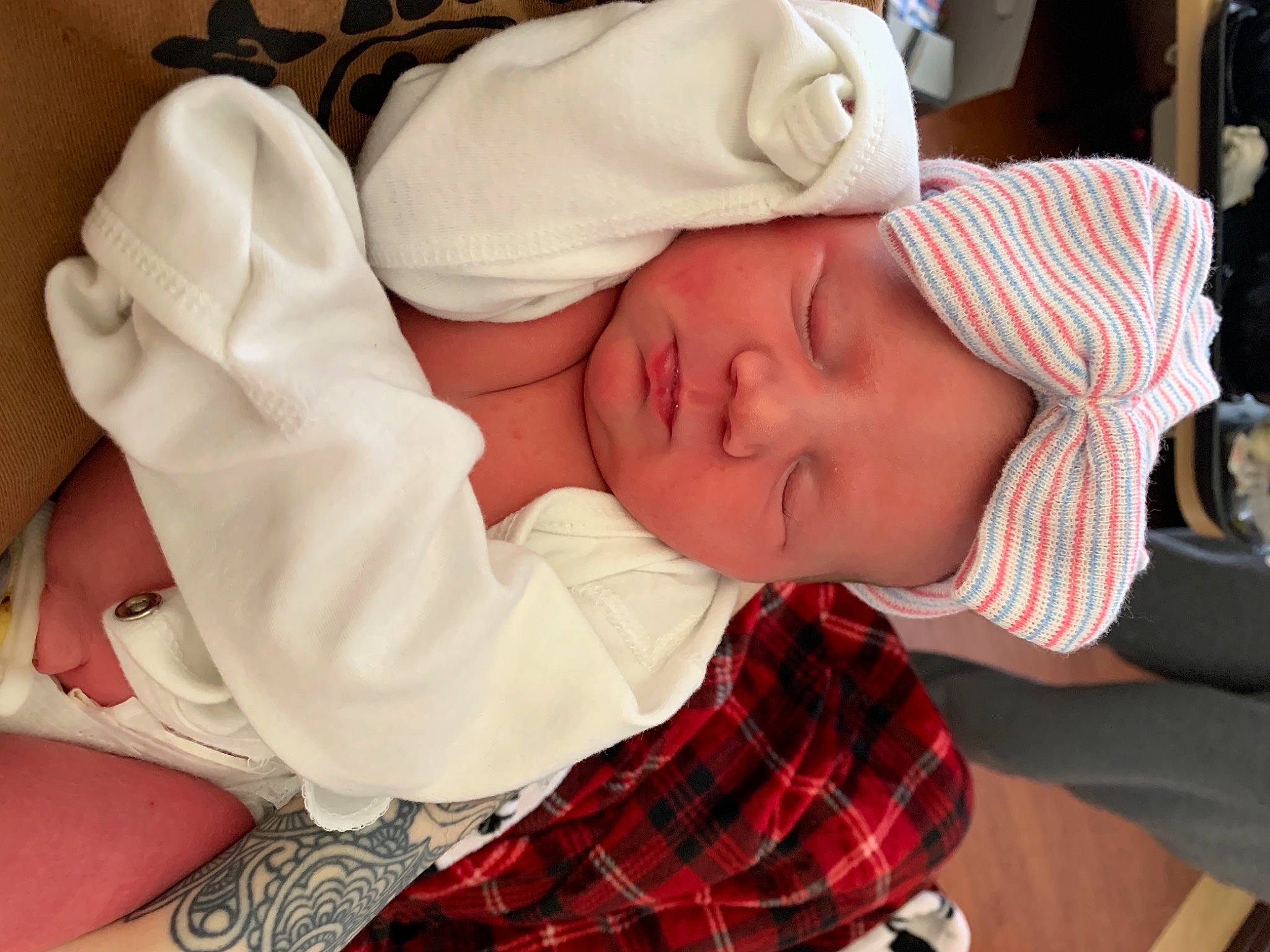 Josephine joined the competition — help win amazing prizes! baby, baby_products, baby_sleeping, baby_toddler_clothing, cap, child, comfort, elbow, finger, hat, headwear, mouth, nap, pattern, person, plaid, sleeve, tartan, textile, thumb