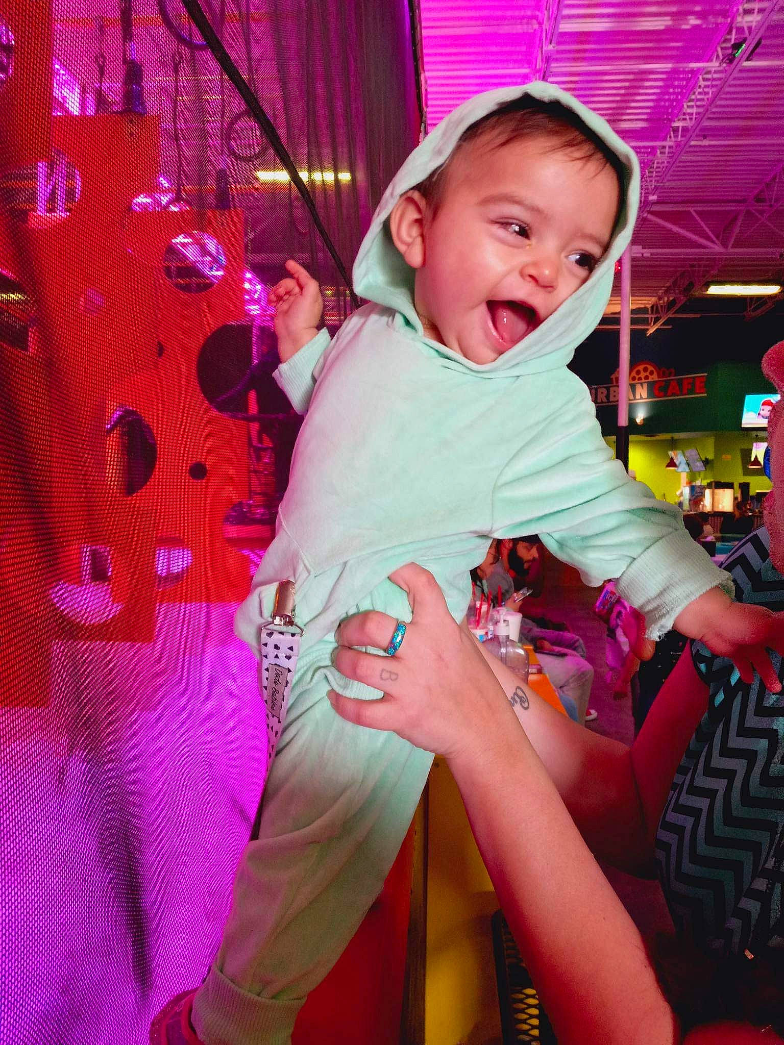 Layken is registered to the contest to win money with this photo: baby, baby_toddler_clothing, chair, child, entertainment, event, fun, happy, headwear, lap, leisure, magenta, party, pattern, person, pink, purple, recreation, room, sitting