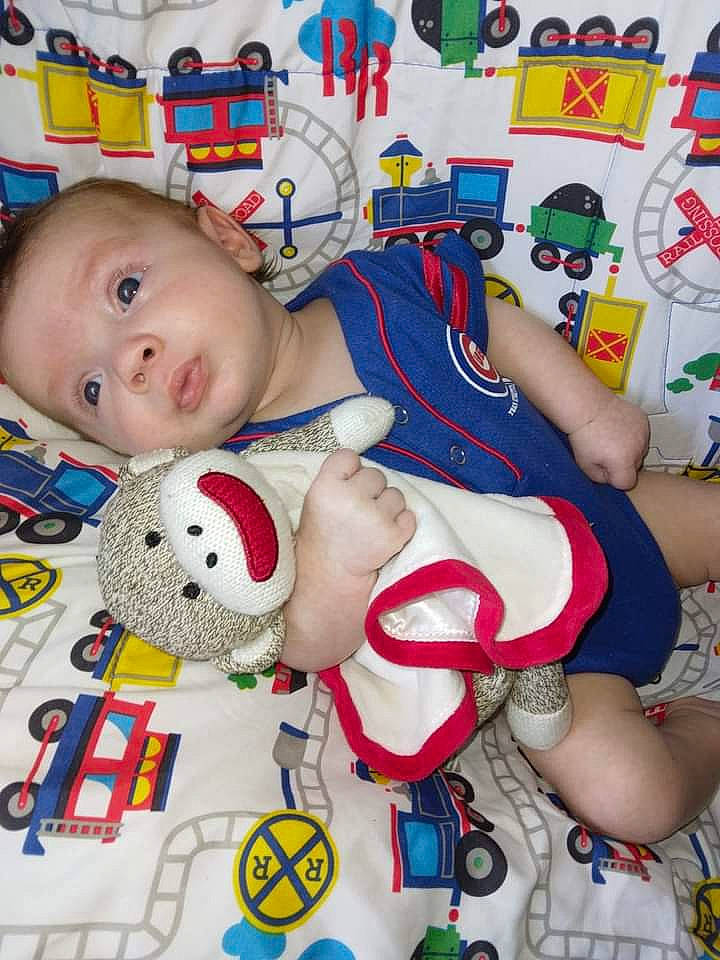 Braxton is registered to the contest to win money with this photo: baby, baby_toddler_clothing, baby_toys, carmine, cheek, child, facial_expression, fun, happy, mammal, mouth, pattern, person, plush, red, stuffed_toy, textile, thigh, toddler, toy
