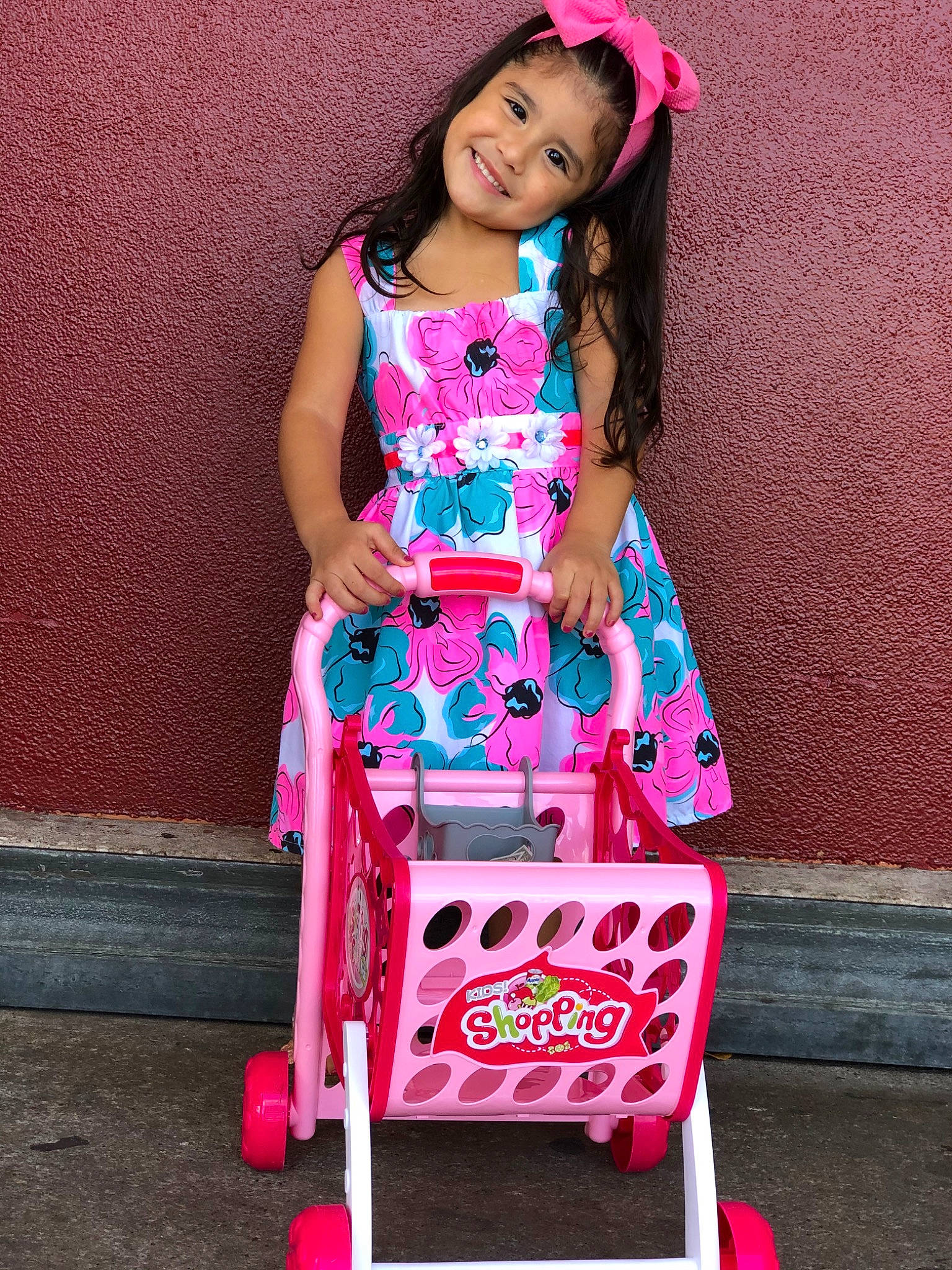 Aryana joined the competition — help win amazing prizes! baby_products, child, child_model, clothing, costume, dress, fashion_design, joy, magenta, pattern, person, photo_shoot, photography, pink, play, product, sitting, toddler, vehicle