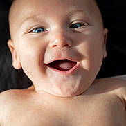 Elio is registered to the contest to win money with this photo: baby, smiling, blue_eyes, close_up, portrait, infant, skin, happy, child, cute, face, expression, natural_light, bare_chest, young, human, joy, cheerful, head, newborn