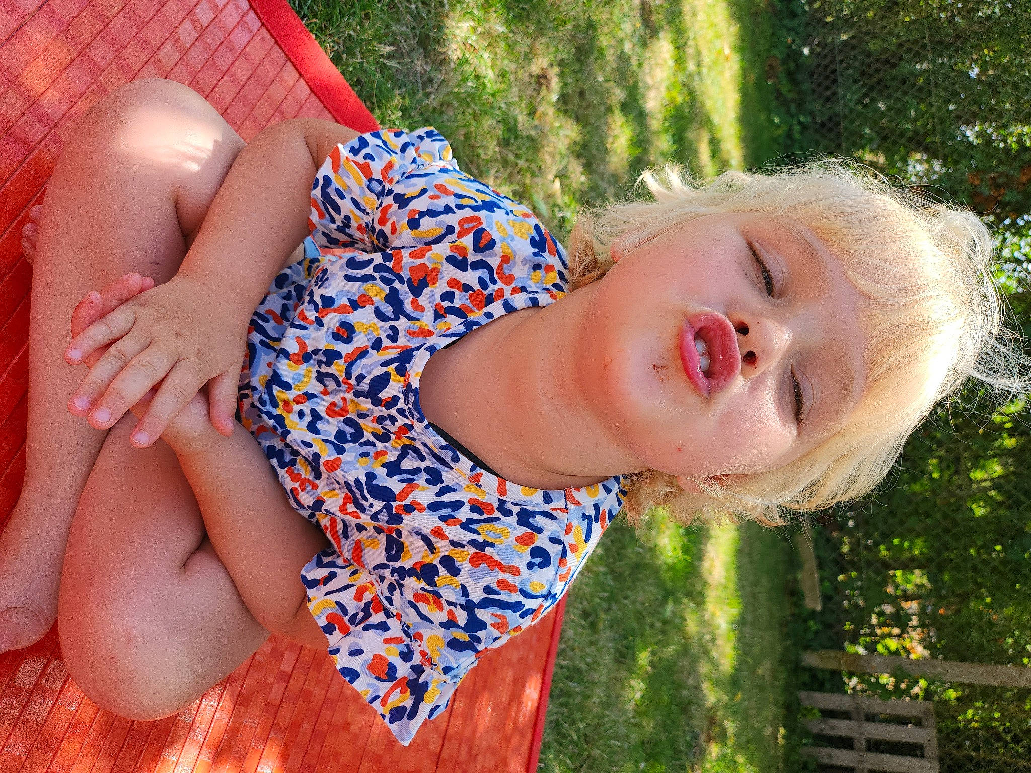 Ilyana participe au concours pour gagner de l'argent avec cette photo : beauty, blond, child, electric_blue, facial_expression, fun, grass, hairstyle, happy, human_leg, leisure, lip, mouth, people_in_nature, person, plant, skin, smile, sunlight, thigh