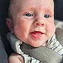 baby, infant, face, blue_eyes, smiling, car_seat, seatbelt, striped_clothing, closeup, skin, child, safety, cute, portrait, young_child, person, expression, indoor, soft_light, head