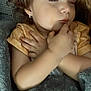 Hazelee is registered to the contest to win money with this photo: child, toddler, sleeping, blanket, cozy, indoors, earring, peaceful, face, portrait, cute, resting, soft_lighting, curly_hair, baby, hands, closed_eyes, comfort, relaxation, person