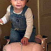 Hazelee joined the competition — help win amazing prizes! toddler, child, toy_car, pink, bow, indoor, floor, denim_overalls, long_sleeve_shirt, cute, small_vehicle, playtime, young_child, portrait, smile, curly_hair, person, baby, fun, kid