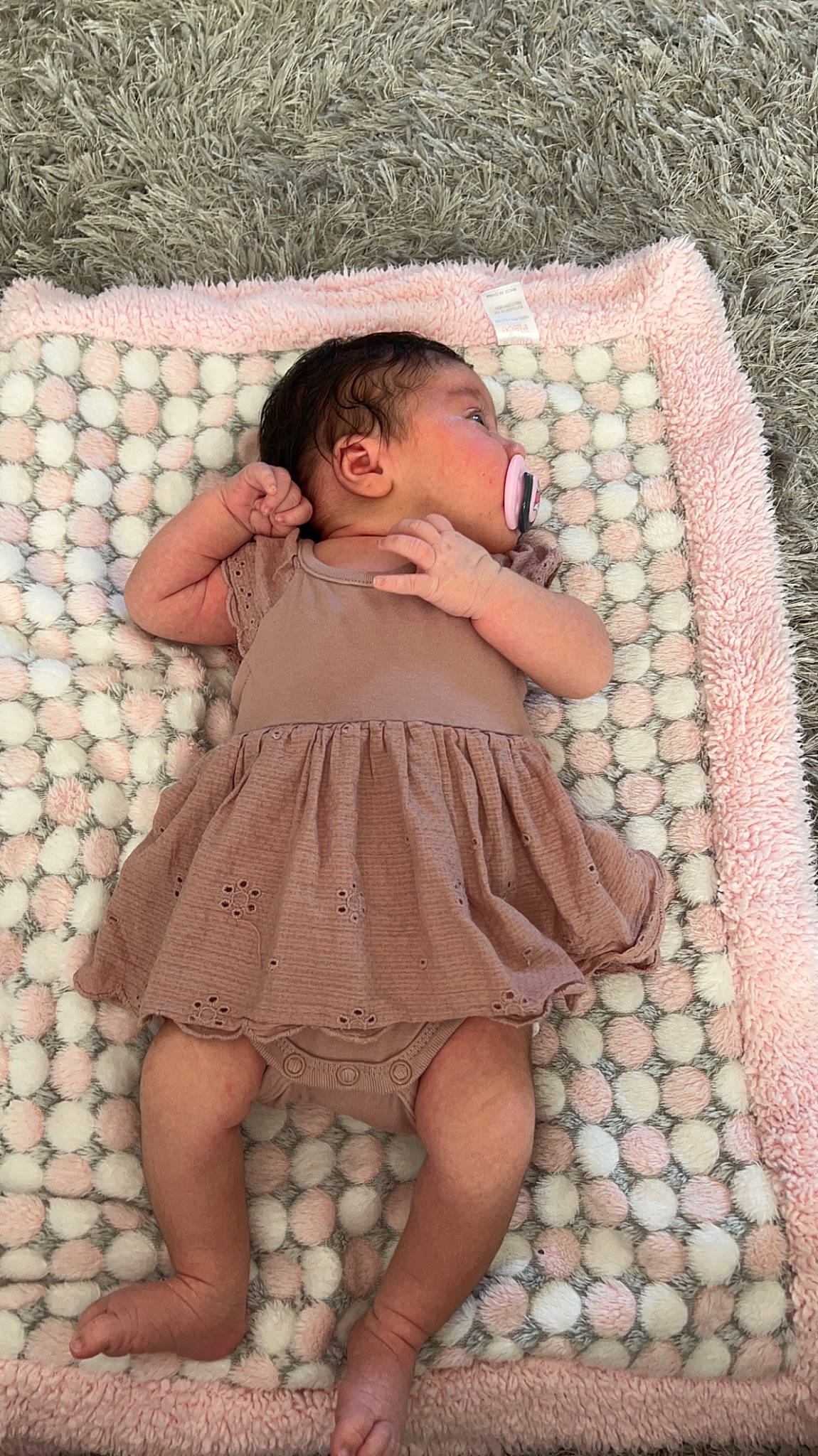Amelia joined the competition — help win amazing prizes! arm, baby, baby_toddler_clothing, child, comfort, day_dress, dress, finger, grass, hand, human_body, knee, leg, pattern, person, pink, skin, sleeve, textile, thigh