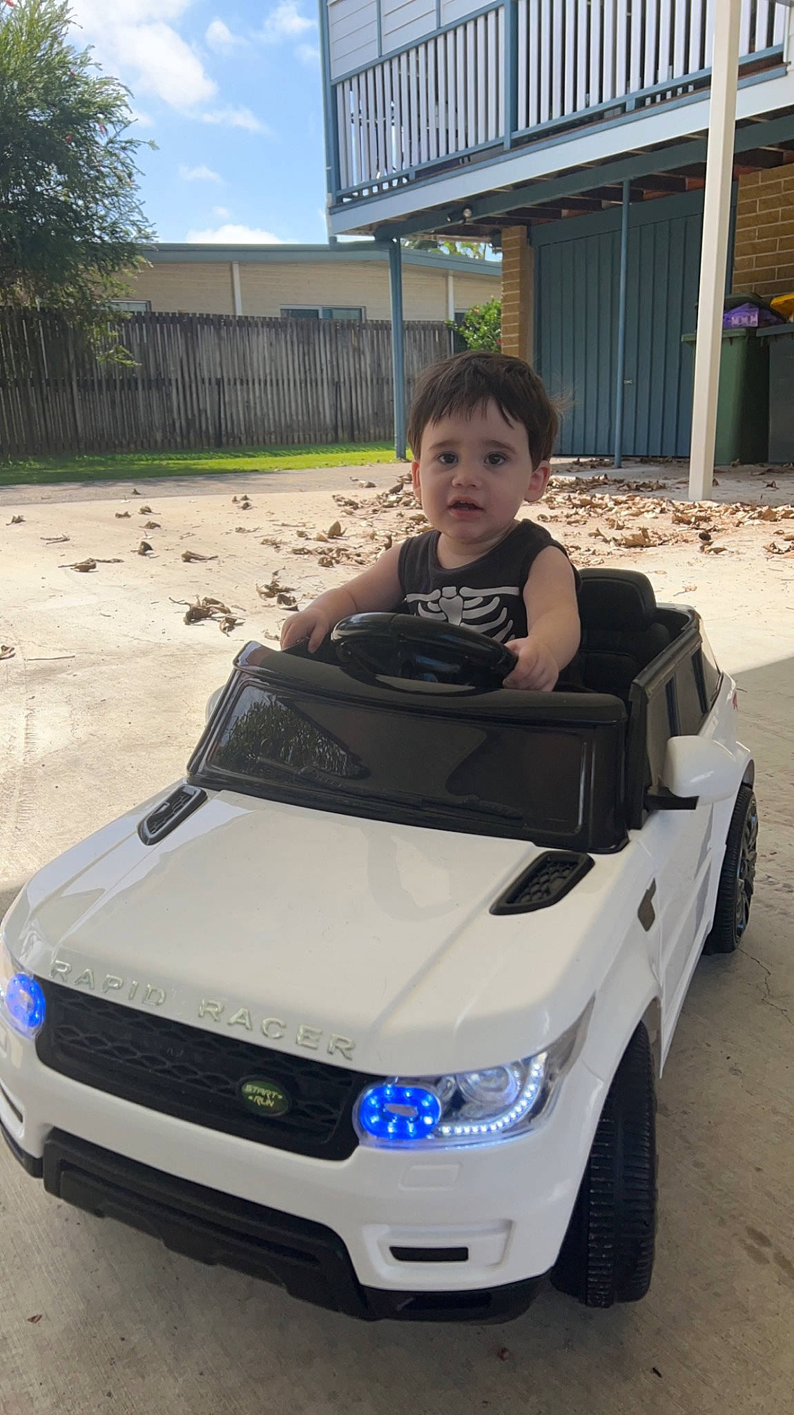 Elijah is registered to the contest to win money with this photo: automotive_design, automotive_exterior, automotive_fog_light, automotive_lighting, automotive_tire, automotive_wheel_system, bumper, car, fender, grille, hood, motor_vehicle, person, plant, rim, sky, steering_wheel, tire, tree, vehicle