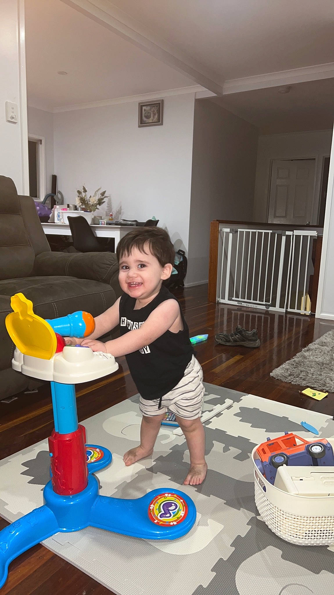 Elijah joined the competition — help win amazing prizes! child, comfort, electric_blue, floor, flooring, fun, hardwood, houseplant, joy, leisure, person, plant, play, room, shorts, sitting, smile, t_shirt, thigh, toddler