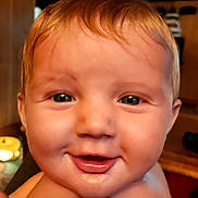 Cooper joined the competition — help win amazing prizes! baby, child, infant, smiling, happy, portrait, close_up, face, eyes, mouth, red_hair, drool, bare_shoulders, indoor, home, television, furniture, warm_lighting, photography, family_snapshot