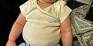 Amir is registered to the contest to win money with this photo: baby, infant, child, nike, clothing, shorts, shirt, socks, blanket, pattern, face, eyes, skin, legs, arm, cute, portrait, indoor, relaxed, soft